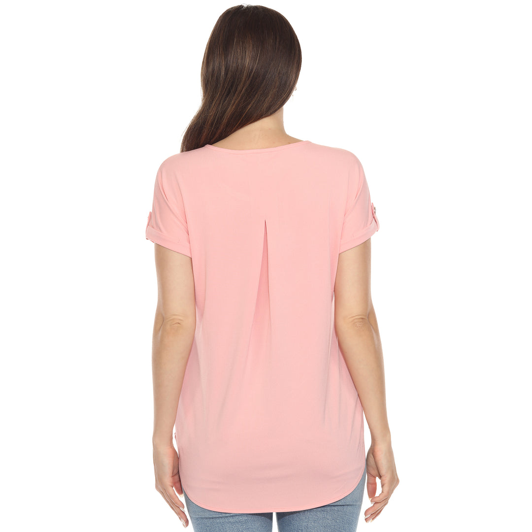 Women’s soft pink short sleeve top with rolled cuffs and button-tab detail, relaxed fit for casual wear.