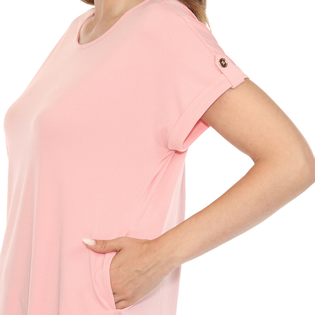 Women’s soft pink short sleeve top with rolled cuffs and button-tab detail, relaxed fit for casual wear.