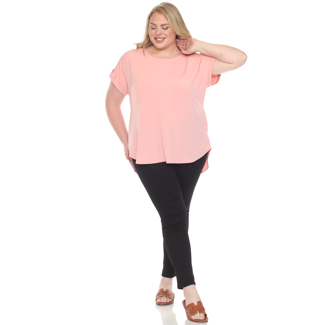 Plus size Pink short sleeve top in soft knit, featuring button-tab detail, ideal for casual everyday wear.