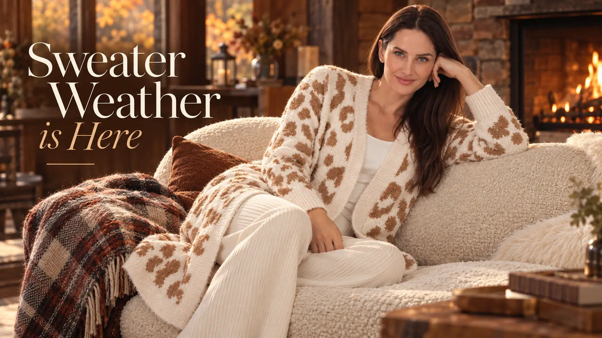 Woman in a leopard-print knit cardigan by a fireplace, Sweater Weather - White Mark